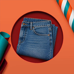 A folded pair of denim jeans