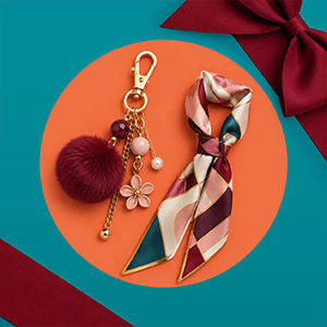 An embellished handbag charm and scarf