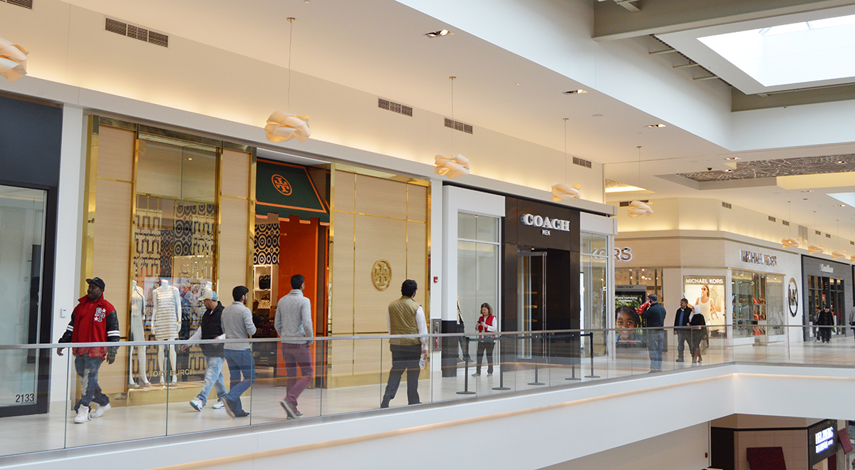 Shoppers walking around Fashion Outlets of Chicago