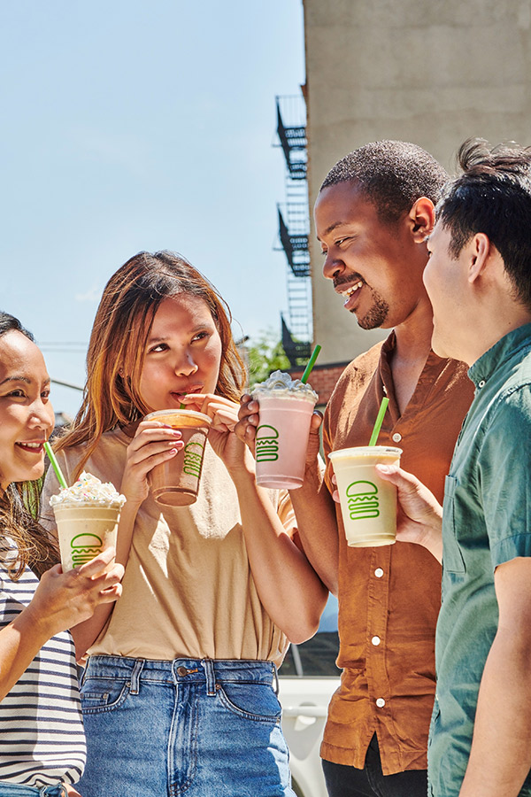 A group of students enjoying Shake Shack food and drinks