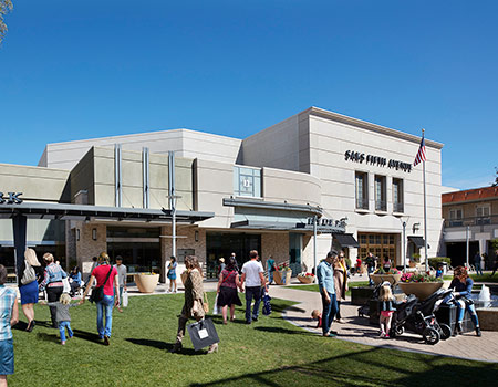 People shopping at Biltmore Fashion Park's outdoor area by the fountain