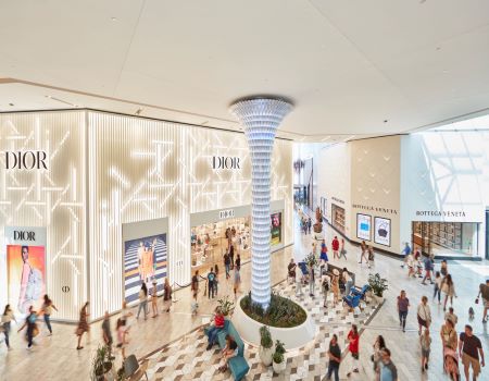 shoppers inside scottsdale fashion square with crystal column