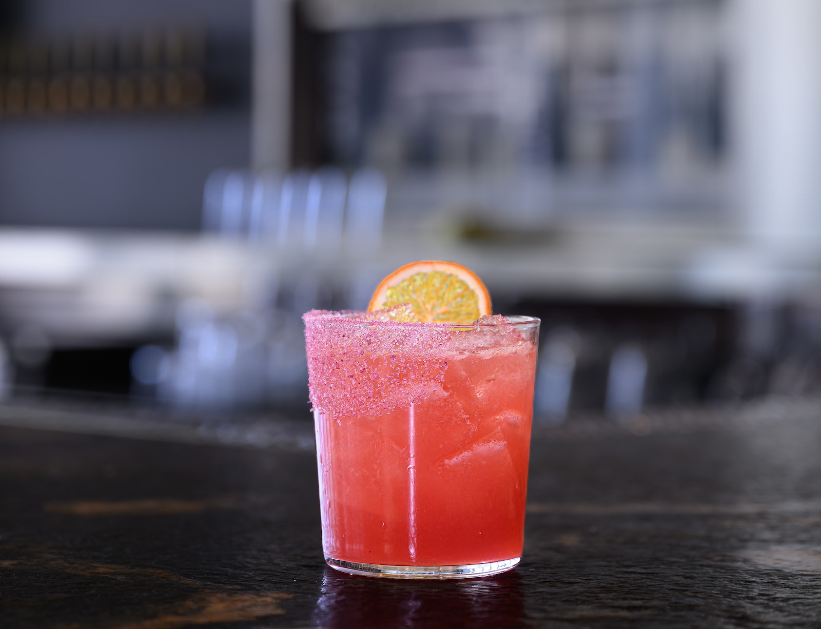 light pink margarita with a garnish 