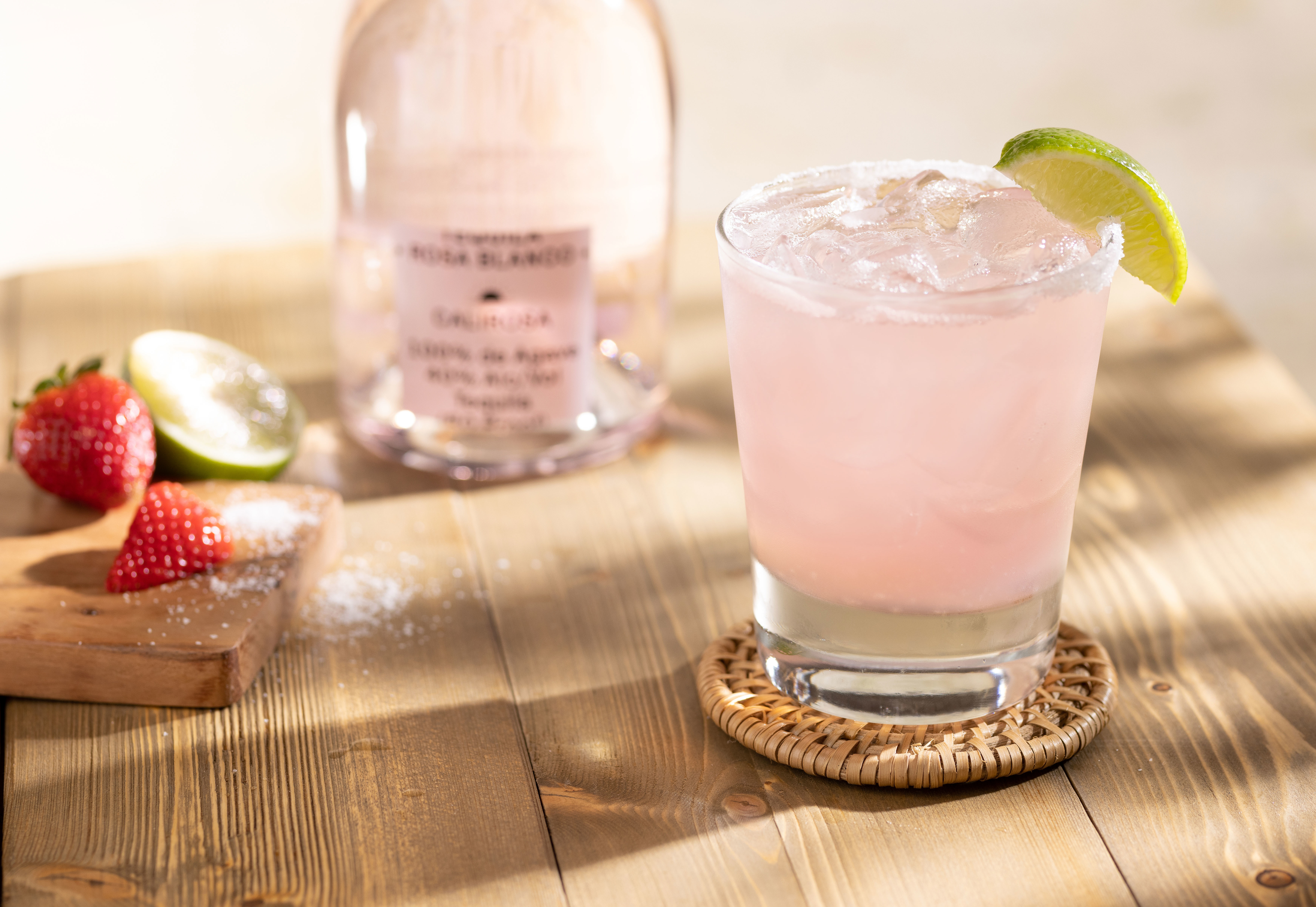 light pink margarita with a lime garnish