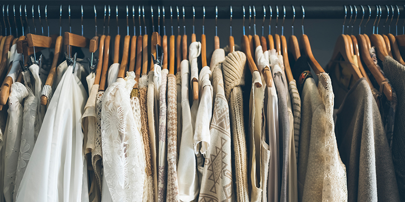 White and beige clothing on hangers