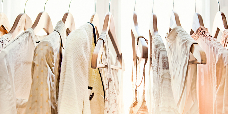 Light-colored clothes on hangers