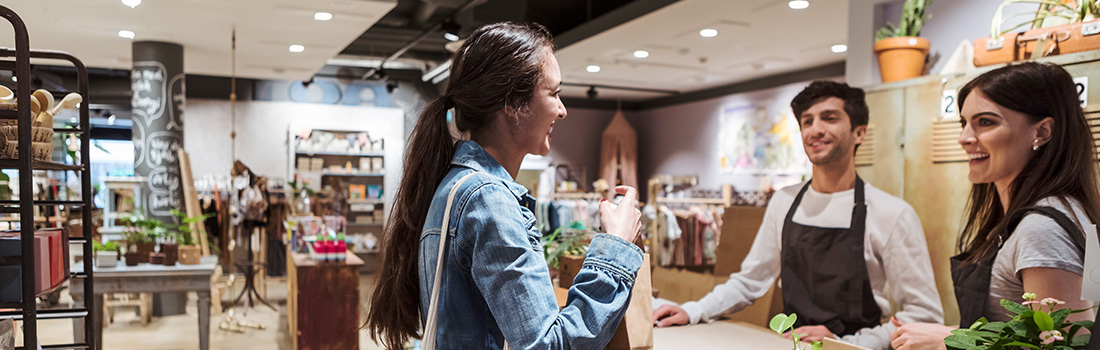 A female customer making a purchase at a boutique