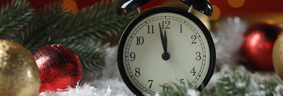 Clock on some fake snow and holiday ornaments