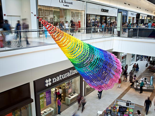 Multicolored installation suspended from the ceiling at Fashion Outlets of Chicago