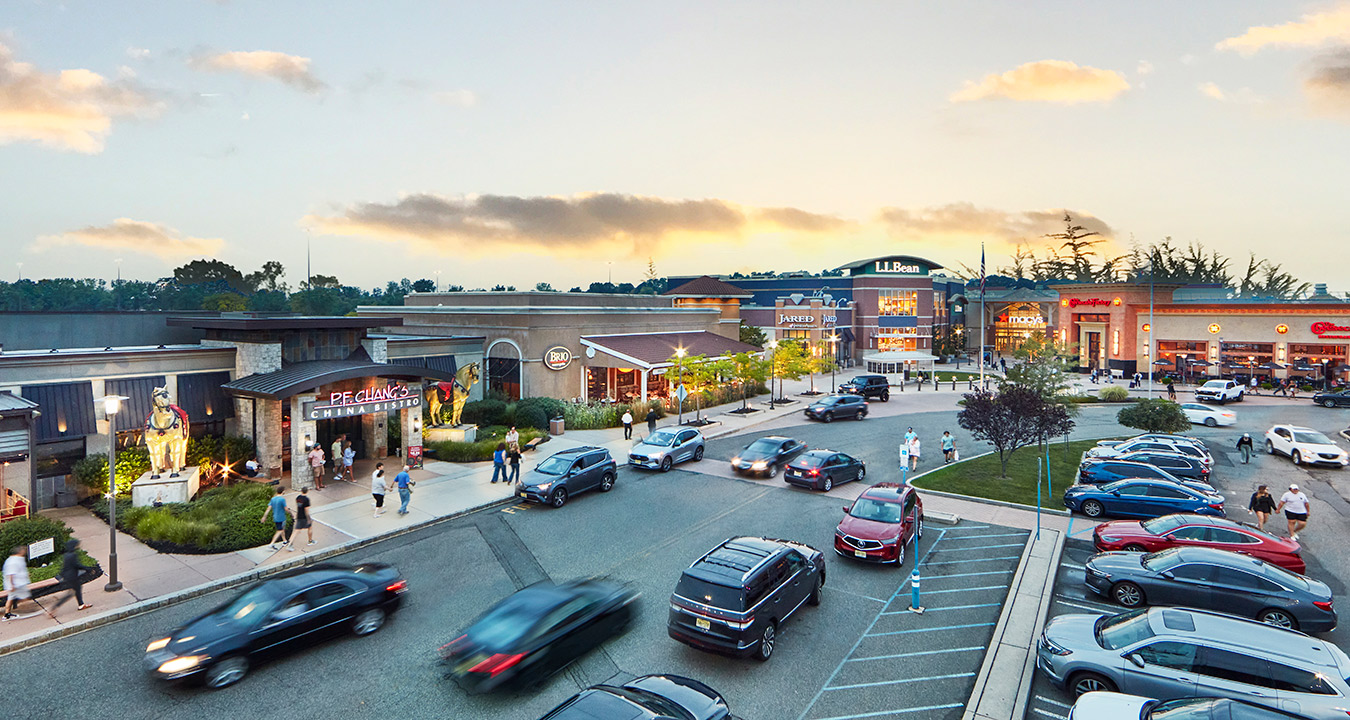 Freehold Raceway Mall's exterior at dusk