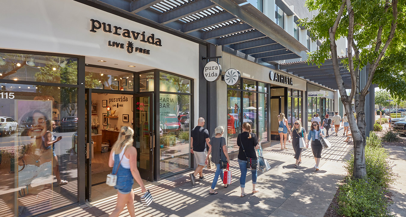 Shoppers enjoying SanTan Village's outdoor shopping corridors