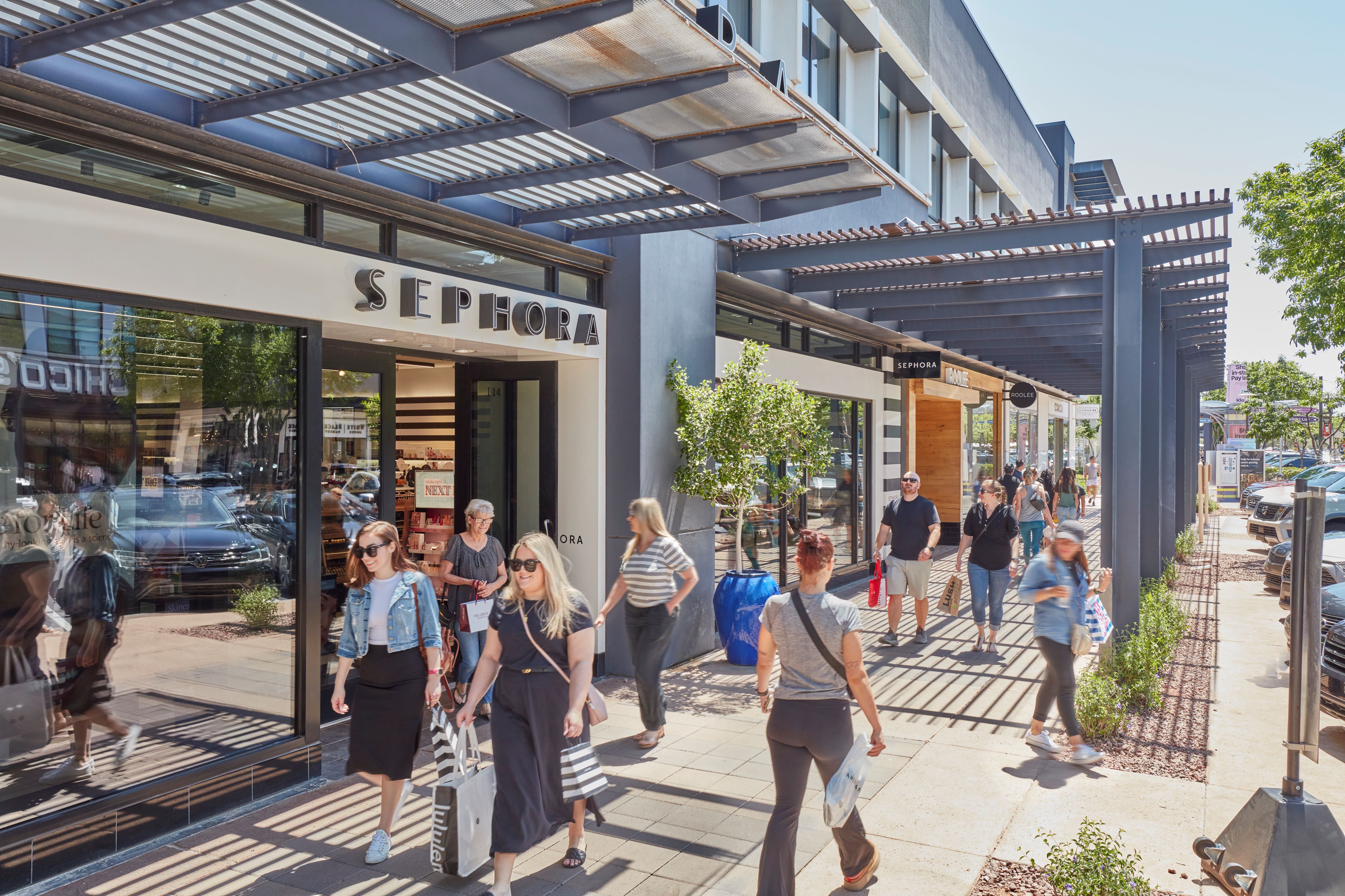 Shoppers enjoying SanTan Village's outdoor shopping corridors
