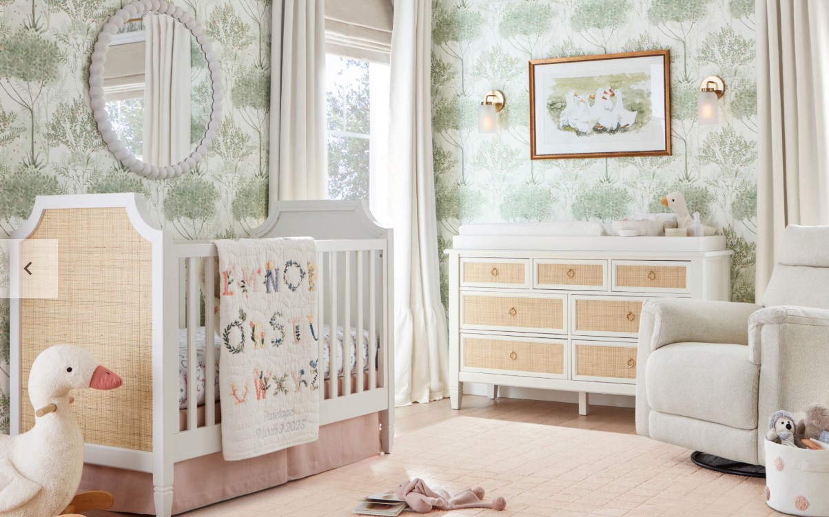 A nursery done in beige and white furniture, blankets and accessories