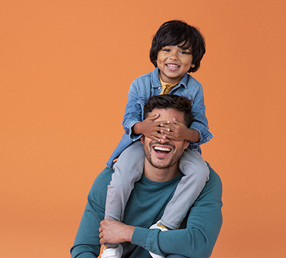 Son sitting on Dad's shoulders