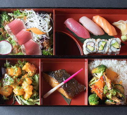 Sushi, sashimi, rice, vegetables with rice and wasabi