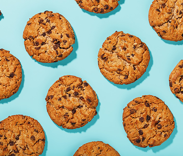 Chocolate chip cookies on a turquoise background