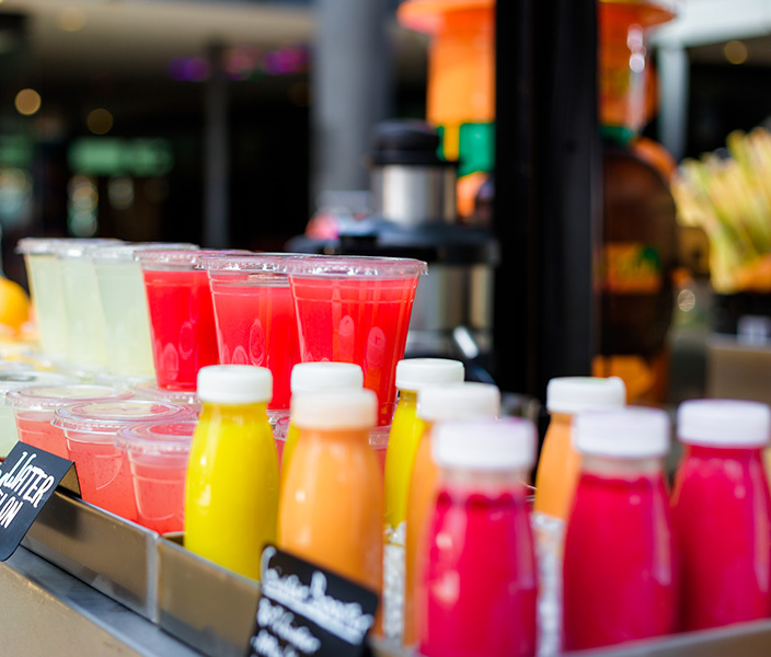 Fresh fruit juices on display for customers