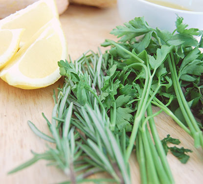 Lemon and herbs on a cutting board