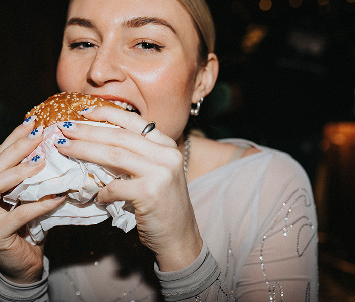 A woman eating a burger