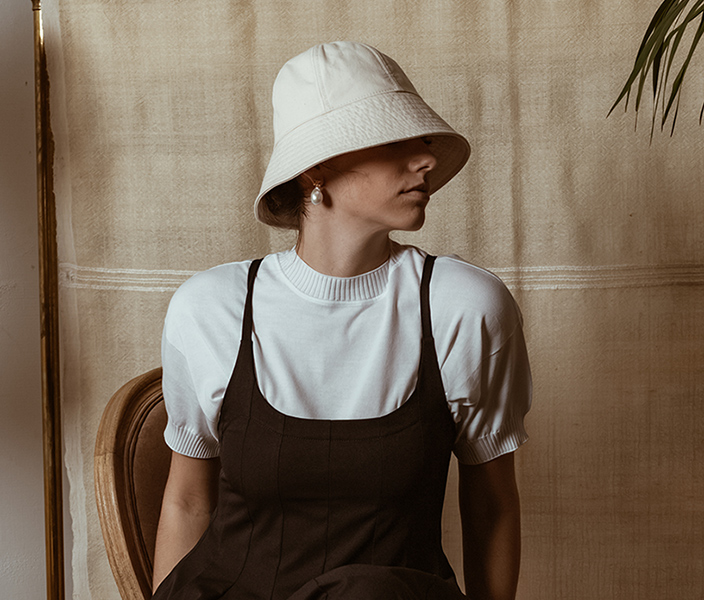 A woman in a stylish bucket hat