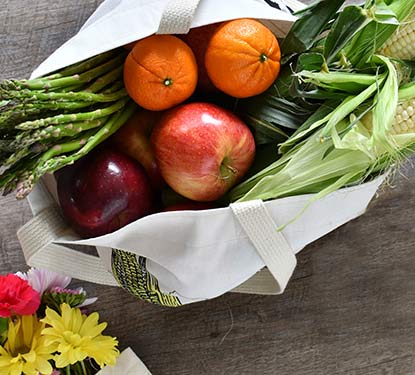 Tote filled with fruits and vegetables
