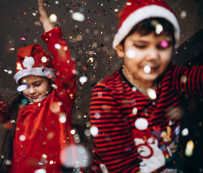 Two kids having fun at a holiday event