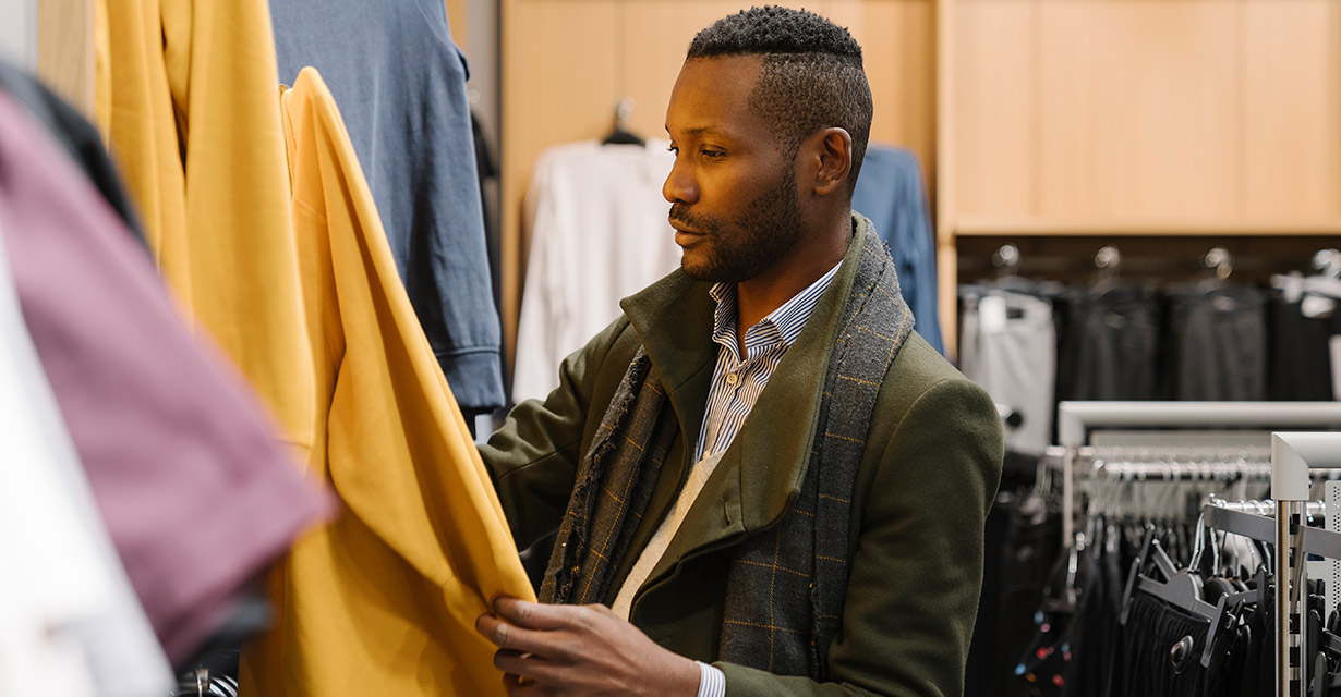 A stylish man shopping for clothes