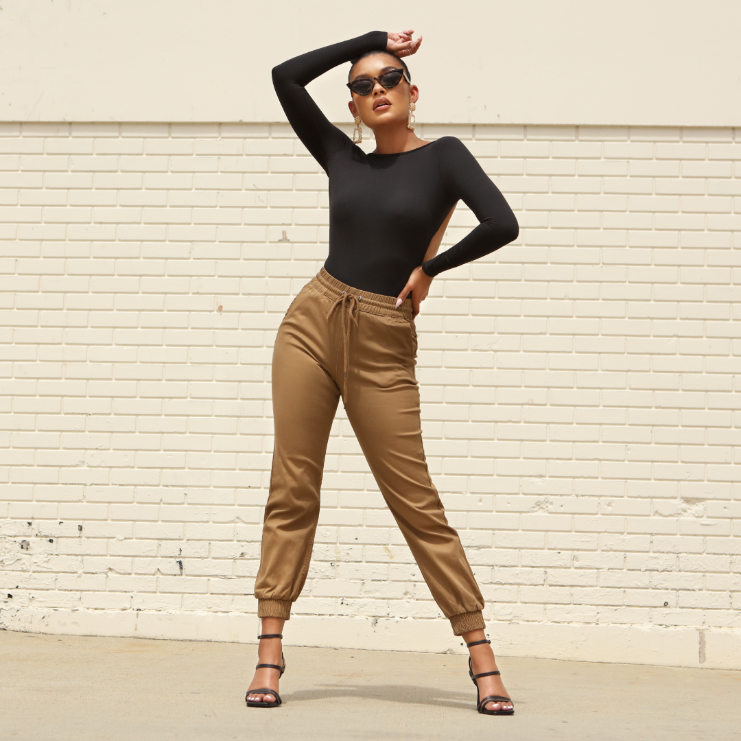 woman in fashion forward outfit posing