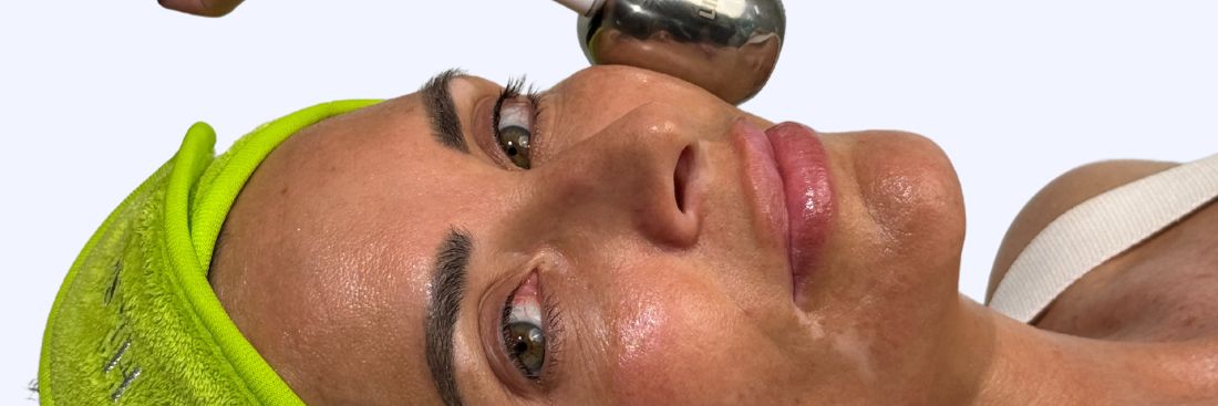A guest at Hi, Skin receiving a facial treatment