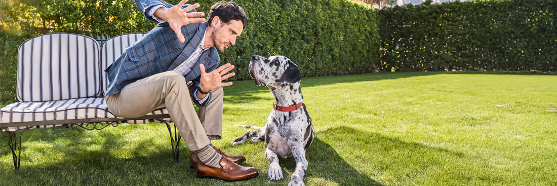 Man and Dog sitting in the yard 